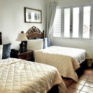 Double Double Room at Acacia Boutique Hotel with two comfortable king-sized beds and ample space.