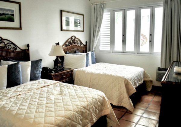 Double Double Room at Acacia Boutique Hotel with two comfortable king-sized beds and ample space.