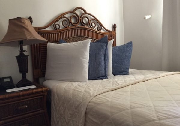 Economy Double Room at Acacia Boutique Hotel with two king-sized beds and a cozy atmosphere.